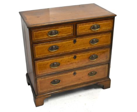 An early 19th century crossbanded mahogany chest of two short and three long drawers, raised on bracket feet, length 84cm, de