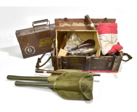 A mixed group of military equipment including entrenching tools, rope pulls, button guards, a multitool, a flag featuring Uni