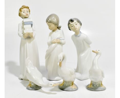 NAO; six assorted ceramic figures including a child holding books, height 30cm (6).Additional InformationMinimal wear, overal