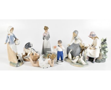 BING & GRONDAHL; a ceramic figure of a boy holding a ball, height 7cm, together with a Lladró figure and assorted Nao figures