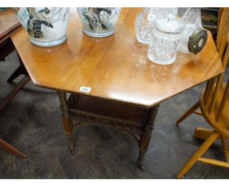 An Edwardian octagonal oak occasional table with under tier 