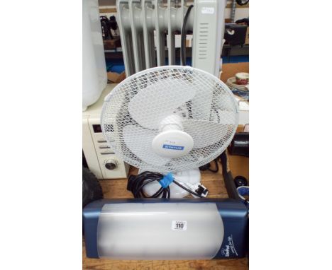 A small oil filled electric radiator, an oscillating fan and a Light Pod light