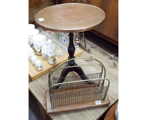 A copper topped wine table and a brass magazine rack 