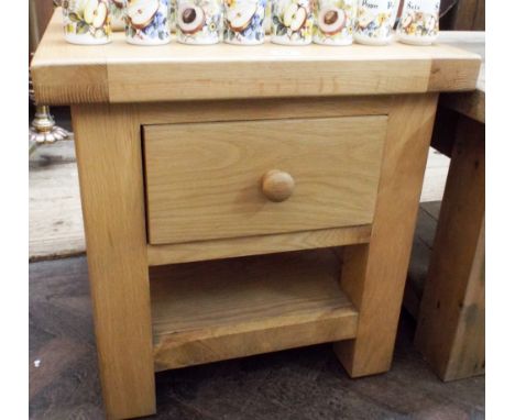 A two tier heavy square light oak coffee table fitted one drawer 