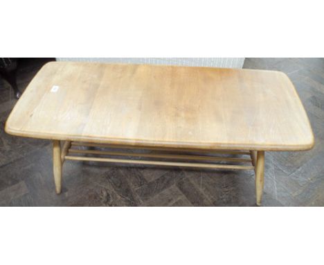 A long Ercol light elm coffee table with under tier 