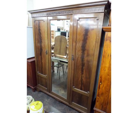 A 1920's mahogany three door semi fitted wardrobe with mirrored centre 5' wide 