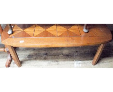 A long oak coffee table with parquetry style top 