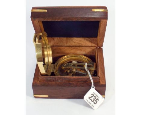 A Brunton brass compass in a hardwood box