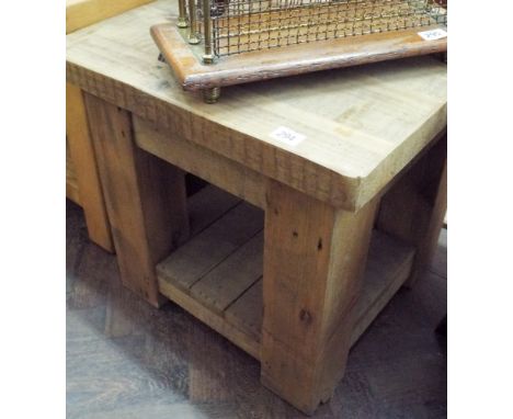 A heavy rustic pine coffee table with under tier 