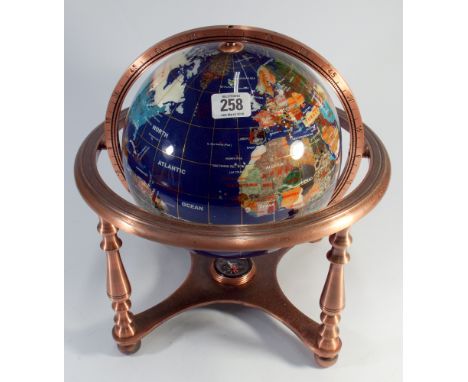 A globe of the world on metal stand