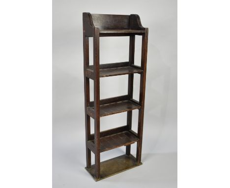 An Edwardian Narrow Oak Galleried Open Four Shelf Bookcase, 33cms Wide and 95cms High