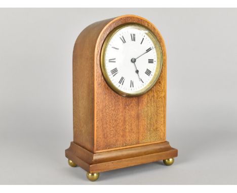 An Edwardian Mahogany Arch Topped Mantel Clock with Working Movement and COmplete with Key, 21cms High