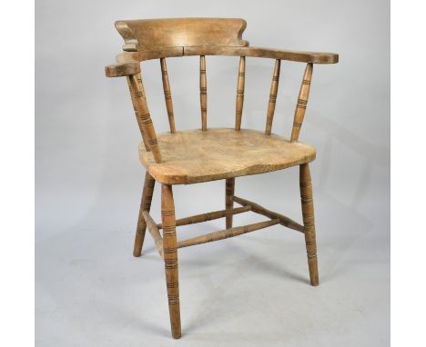 A Vintage Elm Seated Smokers Bow Armchair