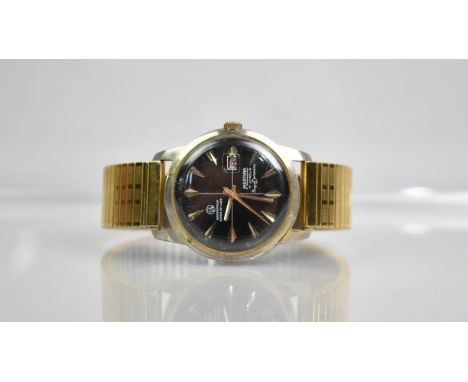 A Vintage Mortimer SuperDatomatic Black Faced Wristwatch with Gilt Arrow Hour Indicators and Gilt Baton Hands, Date Aperture 
