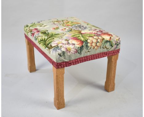 A Vintage Tapestry Upholstered Stool with Chamfered Oak Supports, 40cms by 53cms