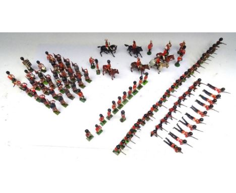 Britains Foot Guards in gaiters firing and in drill positions with Officers, Pipers of the Scots Guards and Officers of the G