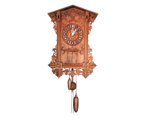 Beautiful black forest flute wall clock. At the precise hours, the flutist's door opens. Musician appears and plays a melody 