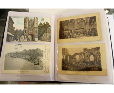 Two albums containing two hundred and fifty vintage postcards