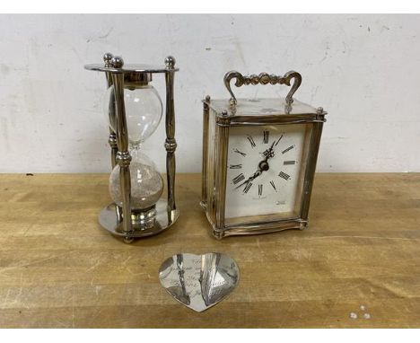 An Astral carriage style clock with battery operated movement, (14cm high), and a hour glass and heart shaped plaque, (3)