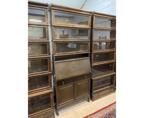 A Globe Wernicke bureau bookcase with three tier bookcase above bureau, fitted with pigeon holes to interior over single frie