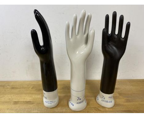 A collection of three 1978 ceramic models of hands, inscribed General Porcelain Trenton NJ USA, (40cm high)