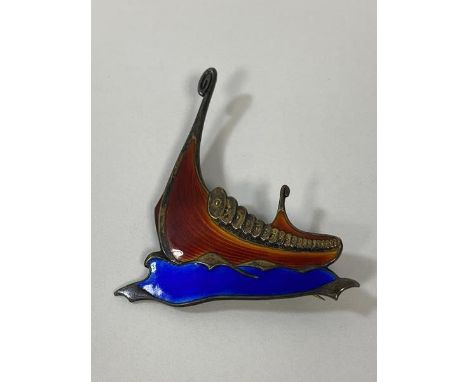 A Norwegian silver and enamel brooch in the form of a Viking long ship, (5.5cm x 4cm)