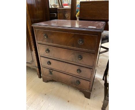 A 1930's / 40's reproduction Georgian inspired small chest of drawers, the rectangular cross-banded top with moulded edge ove