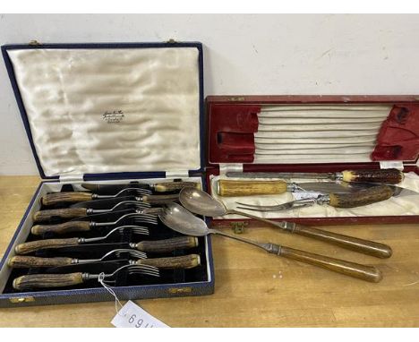 A set of six horn handled knives and forks in original box, (fork 19cm) and a horn handled carving set and wooden handled sal