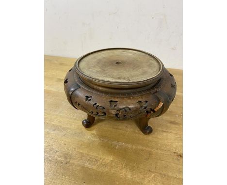 A Chinese circular stand with pierced apron on four C scroll supports, likely a lamp base, (12cm x 20cm), a/f