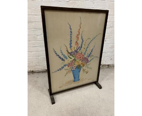 A 1930's / 40's floral embroidered panel within glazed fire screen, ( 99cm x 70cm)
