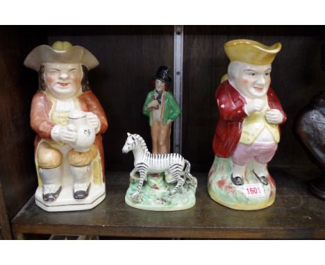 A Victorian Staffordshire pottery snuff taker Toby jug;&nbsp;together with another Staffordshire figure of 'Gin and Water', (
