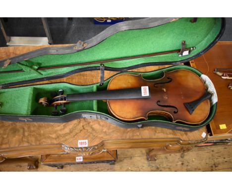 An antique Continental violin,&nbsp;labelled 'Antonius Stradivarius', with 14in two piece back, with bow and case.&nbsp; 