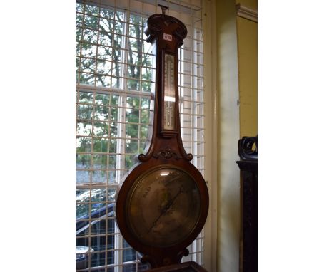 A Victorian mahogany banjo barometer,&nbsp;the 10in silvered dial inscribed 'Wilson, Chichester'. 