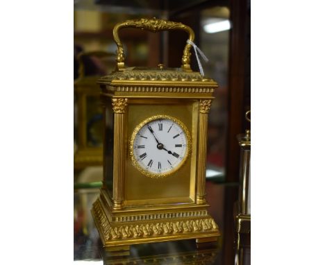 A good gilt brass carriage clock, with push button repeat and gong strike, height including handle 17.5cm, with winding key.&