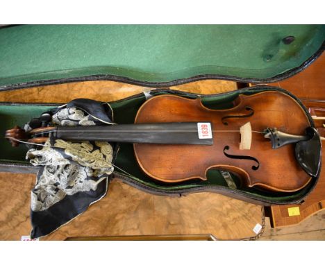An antique Continental violin,&nbsp;labelled 'Antonius Stradivarius', with 14in single piece back, in case.&nbsp; 