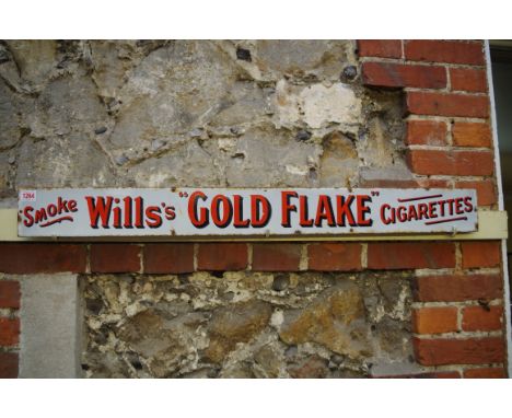A 'Smoke Wills's "Gold Flake" Cigarettes' enamel sign, 10.5 x 101.5cm. 