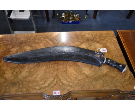 A large Nepalese Gurkha panawal sirupate kukri and scabbard, having 59cm blade. 