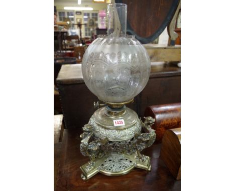 An old cast brass oil lamp, height including shade 45cm.&nbsp; 