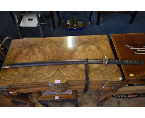 A reproduction of a Japanese katana and scabbard, 69cm blade. 