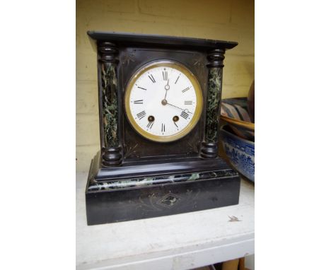 A slate and marble mantel clock, 27cm high.&nbsp;&nbsp; 