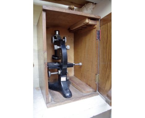 A Beck Model 29 monocular microscope, in oak box. 