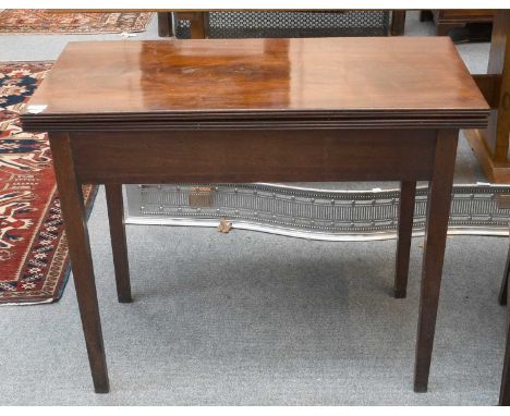 A George III Mahogany Foldover Tea Table, 92cm by 45cm by 74cm, together with A Mahogany Foldover Card Table, of similar date