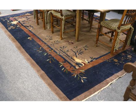 Walter Nichols Chinese Carpet, the pale mushroom field sparsely decorated with a lantern, butterflies and plants, enclosed by