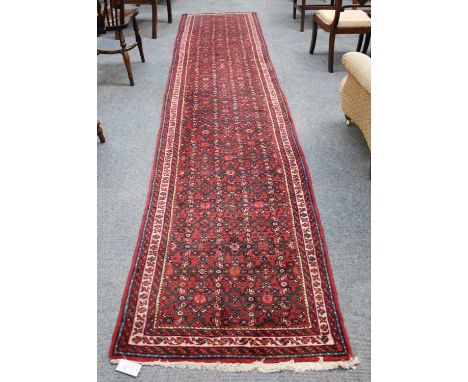 Hosseinabad Runner, the raspberry Herati field enclosed by triple narrow borders, 402cm by 82cm