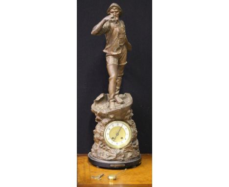 SPELTER CLOCK - a spelter statement clock featuring a gentleman holding up binoculars. The piece stands at 69cm and includes 