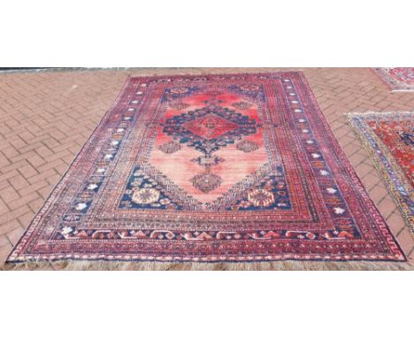 VINTAGE PERSIAN QASHQAI CARPET - a vintage Persian Qashqai carpet, measuring 305x206cm.