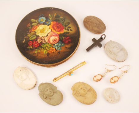 A pair of carved shell cameo 9ct gold drop earrings, each oval shaped dropper carved with the profile of a woman, set in 9ct 