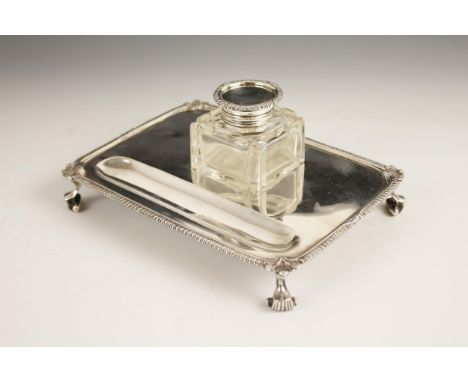 A George V silver cut glass desk stand, Mappin & Webb, Sheffield 1918, the rectangular base with scroll and gadroon border, r