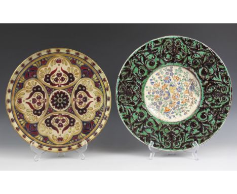 A Zsolnay Pecs charger, early 20th century, the circular dish designed as a central stylised floral boss surrounded by four r