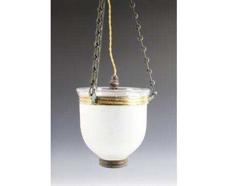 A frosted glass pendant light shade, early 20th century, of domed form, the shade suspended by three chains and eagle mask ho